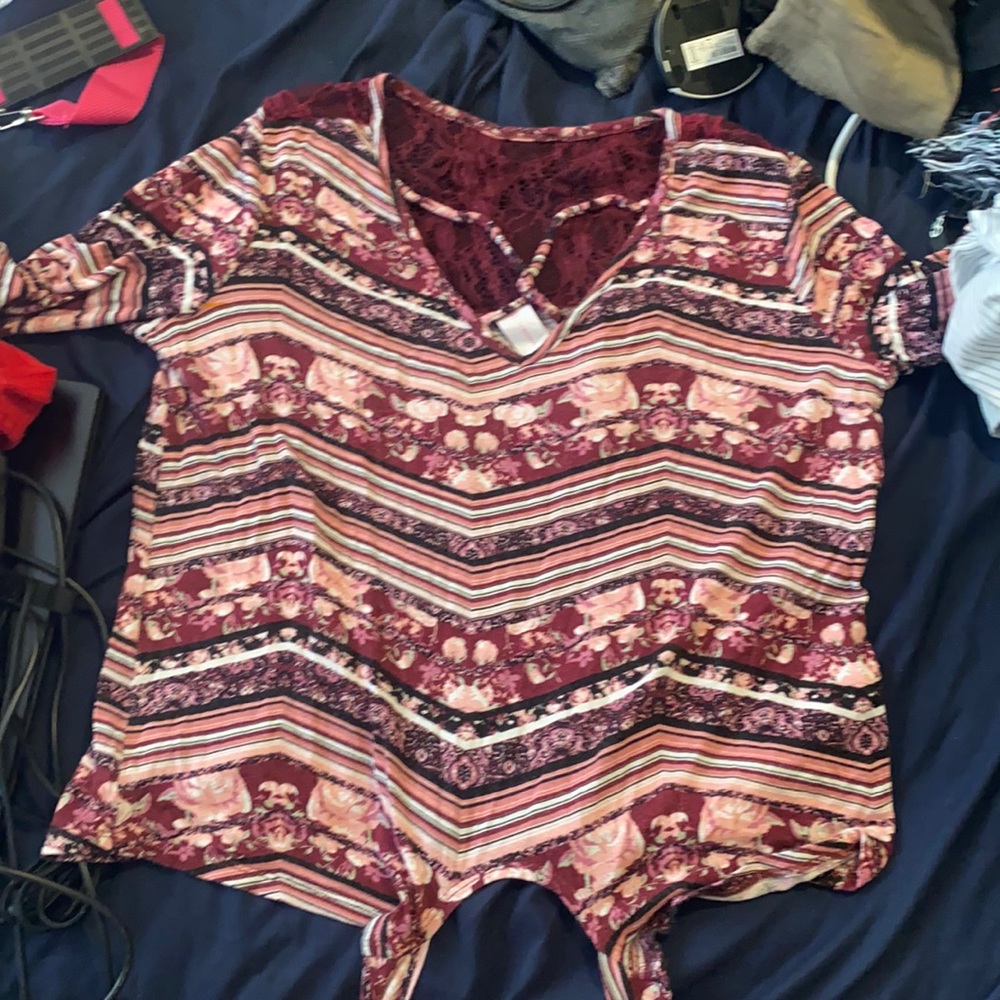 This is a No Boundaries Floral stripped Shirt. It is big on my but it is comfy